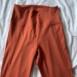 Girlfriend Collective orange rust leggings